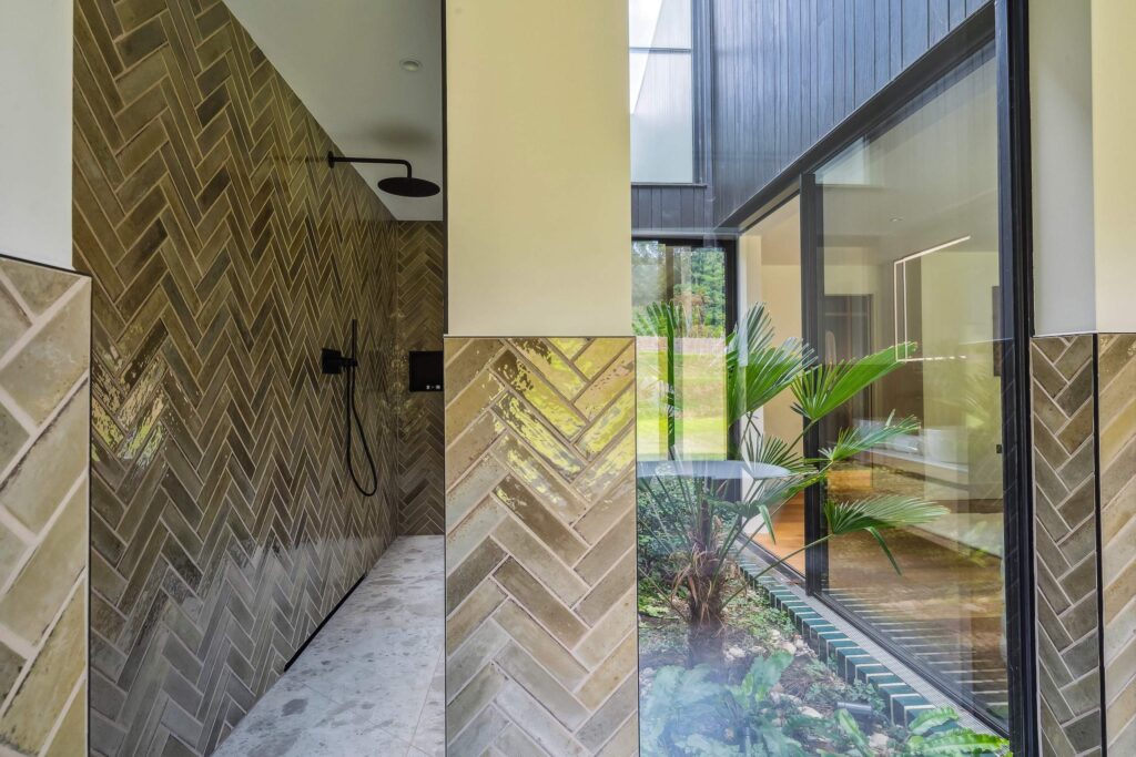 Bathroom shower with green spae